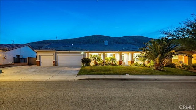 40467 Tiger Way, Palmdale, CA 93551 - ranch-style home with a garage, stucco siding, driveway, and a front yard