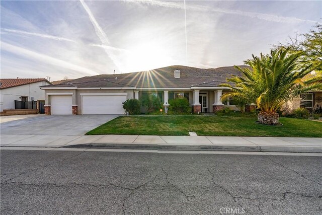 40467 Tiger Way, Palmdale, CA 93551 - view of front of house featuring a garage, a front lawn, stucco siding, and driveway