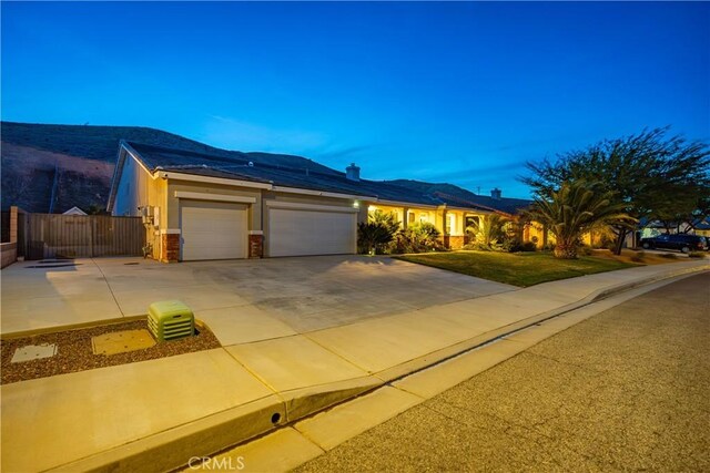 40467 Tiger Way, Palmdale, CA 93551 - single story home featuring stucco siding, fence, driveway, and a garage