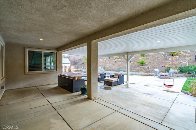 40467 Tiger Way, Palmdale, CA 93551 - view of patio / terrace featuring fence and an outdoor living space with a fire pit