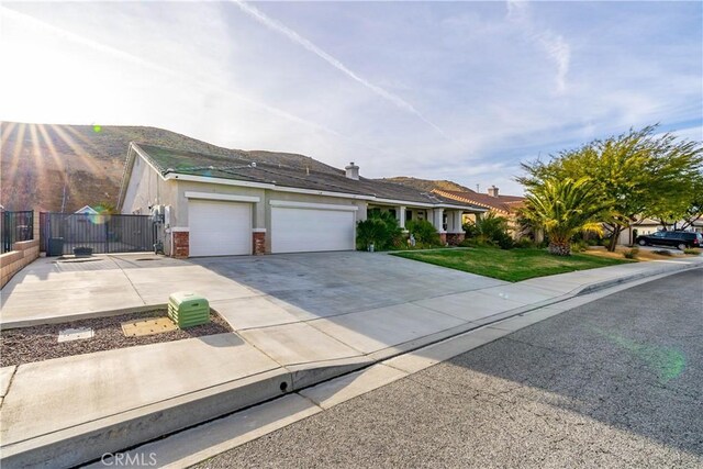 40467 Tiger Way, Palmdale, CA 93551 - view of front of property featuring concrete driveway, an attached garage, fence, and a gate