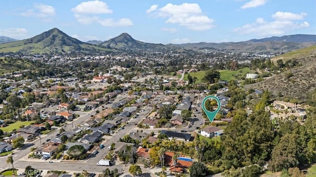 birds eye view of property with a residential view and a mountain view