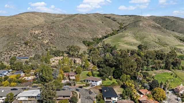 exterior space with a residential view and a mountain view