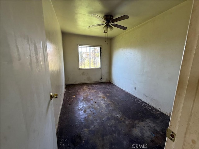 unfurnished room featuring a ceiling fan