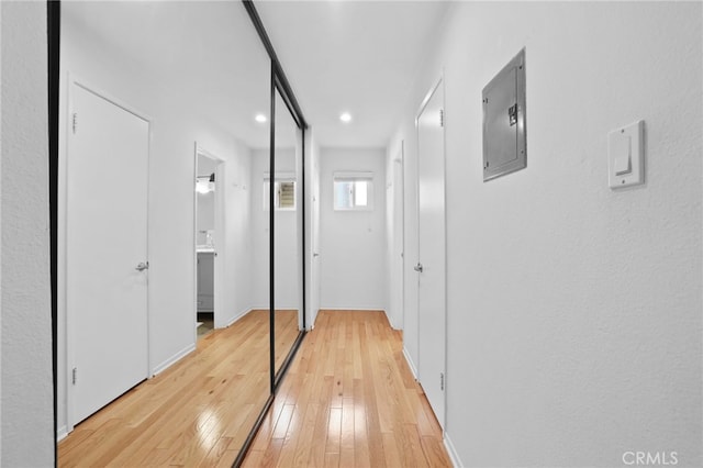 11954 Goshen Ave Unit 205, Los Angeles, CA 90049 - hallway with electric panel, light wood finished floors, recessed lighting, and baseboards