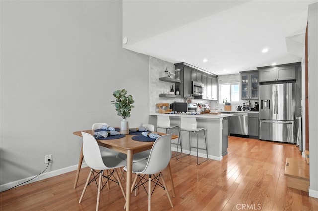 11954 Goshen Ave Unit 205, Los Angeles, CA 90049 - dining space with light wood-style floors, recessed lighting, and baseboards