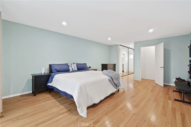 bedroom featuring recessed lighting, baseboards, and light wood-style floors