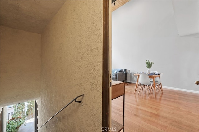 interior space featuring wood finished floors and baseboards