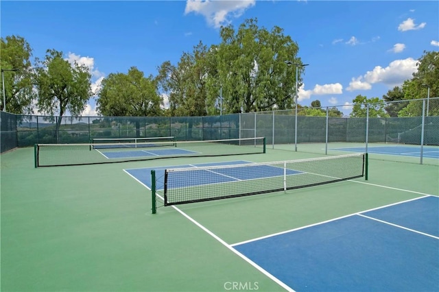 view of sport court with community basketball court and fence