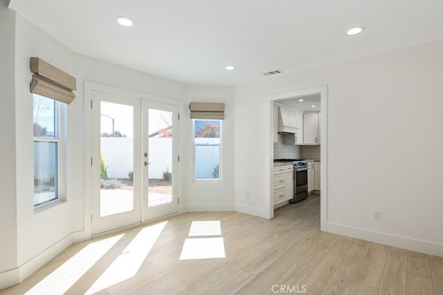 entryway featuring recessed lighting, visible vents, baseboards, french doors, and light wood-type flooring