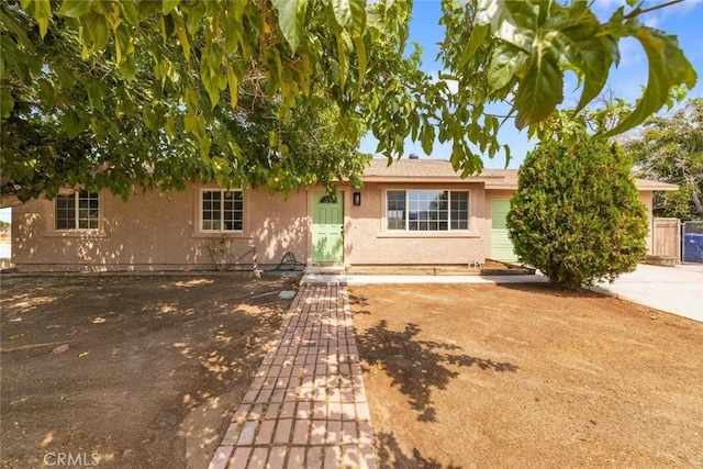 ranch-style home with stucco siding