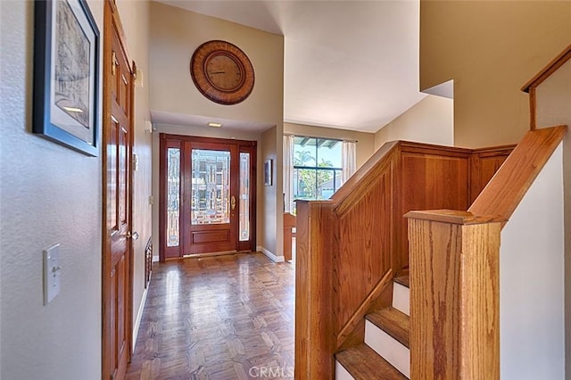 entryway with stairs and baseboards