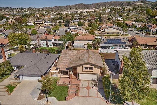 birds eye view of property featuring a mountain view and a residential view