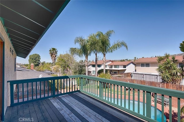 wooden terrace with a residential view