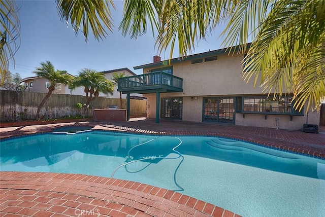 view of pool with a fenced in pool, a patio, and fence