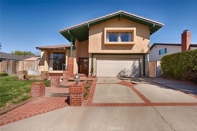 view of front of property featuring fence, driveway, an attached garage, stucco siding, and a front lawn