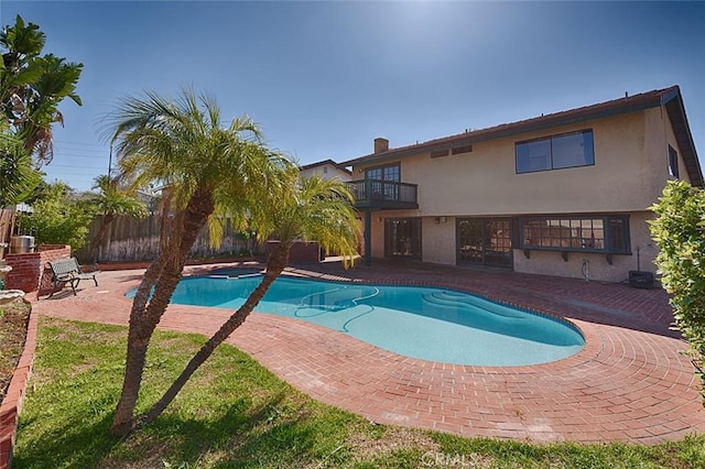 view of pool with a fenced in pool, a patio area, and fence