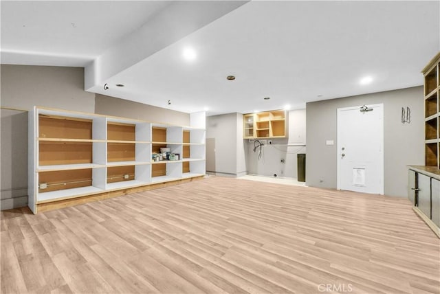 unfurnished living room featuring recessed lighting and light wood-style floors