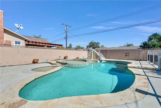 view of pool featuring a fenced in pool, a patio area, an in ground hot tub, a water slide, and a fenced backyard