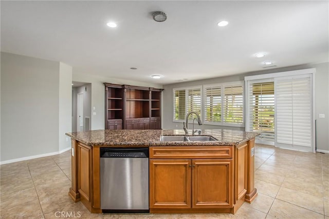 60310 Desert Rose Dr, La Quinta, CA 92253 - kitchen with stainless steel dishwasher, a sink, light tile patterned flooring, a kitchen island with sink, and dark stone countertops