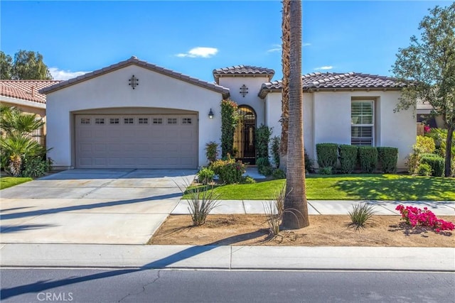 60310 Desert Rose Dr, La Quinta, CA 92253 - mediterranean / spanish-style home with stucco siding, a garage, driveway, and a tiled roof