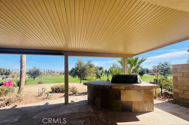 60310 Desert Rose Dr, La Quinta, CA 92253 - view of patio / terrace with an outdoor kitchen