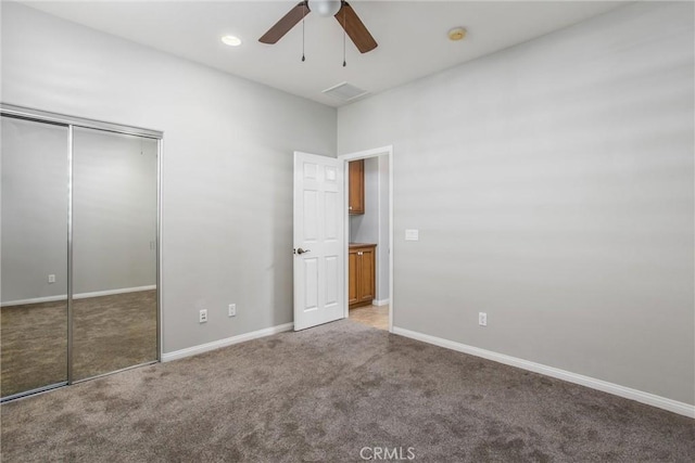 unfurnished bedroom featuring carpet floors, recessed lighting, a closet, ceiling fan, and baseboards