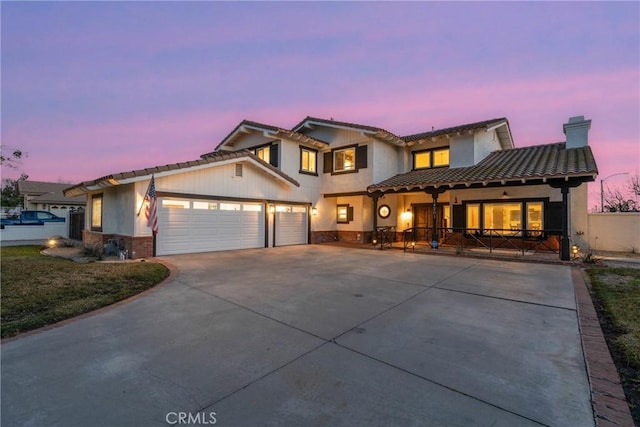 14201 Ross Ct, Rancho Cucamonga, CA 91739 - view of front of home featuring driveway, a garage, a chimney, a tiled roof, and stucco siding