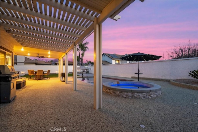 14201 Ross Ct, Rancho Cucamonga, CA 91739 - patio terrace at dusk featuring a fenced backyard, a pergola, a patio, a pool with connected hot tub, and outdoor dining space