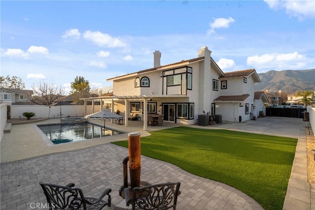 14201 Ross Ct, Rancho Cucamonga, CA 91739 - rear view of property with a fenced backyard, a patio area, and a chimney