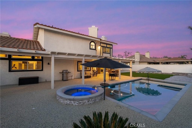 14201 Ross Ct, Rancho Cucamonga, CA 91739 - view of swimming pool with a fenced backyard, a pool with connected hot tub, a patio area, and area for grilling