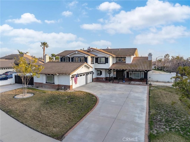 14201 Ross Ct, Rancho Cucamonga, CA 91739 - view of front facade with stucco siding, a tile roof, an attached garage, and concrete driveway