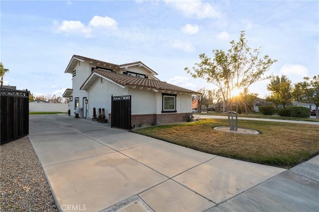 14201 Ross Ct, Rancho Cucamonga, CA 91739 - view of front of home featuring stucco siding, driveway, brick siding, and a tile roof