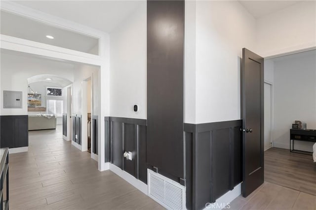 14201 Ross Ct, Rancho Cucamonga, CA 91739 - corridor with arched walkways and light wood-type flooring