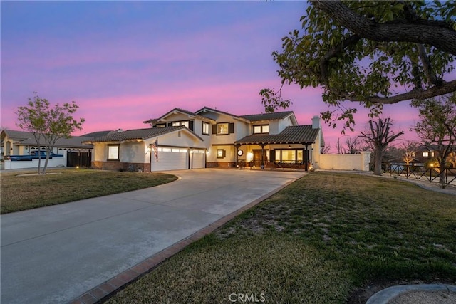 14201 Ross Ct, Rancho Cucamonga, CA 91739 - view of front of property with stucco siding, an attached garage, a chimney, and driveway