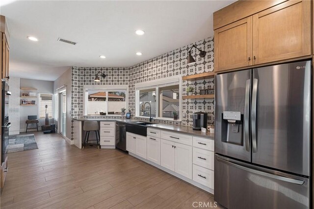 14201 Ross Ct, Rancho Cucamonga, CA 91739 - kitchen featuring stainless steel fridge with ice dispenser, dishwashing machine, recessed lighting, open shelves, and white cabinets