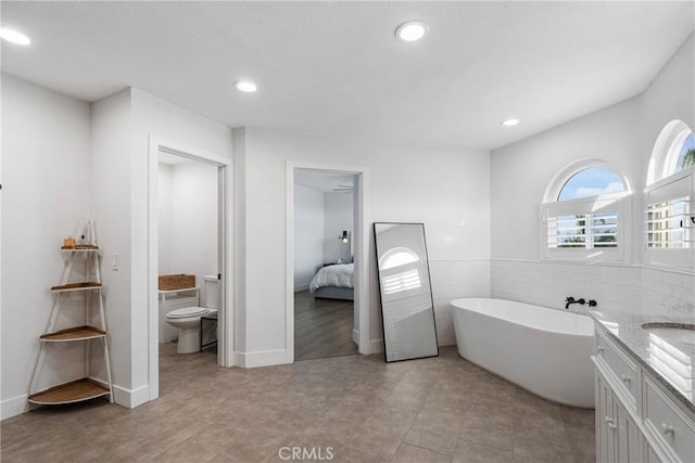14201 Ross Ct, Rancho Cucamonga, CA 91739 - ensuite bathroom with a freestanding tub, vanity, and recessed lighting