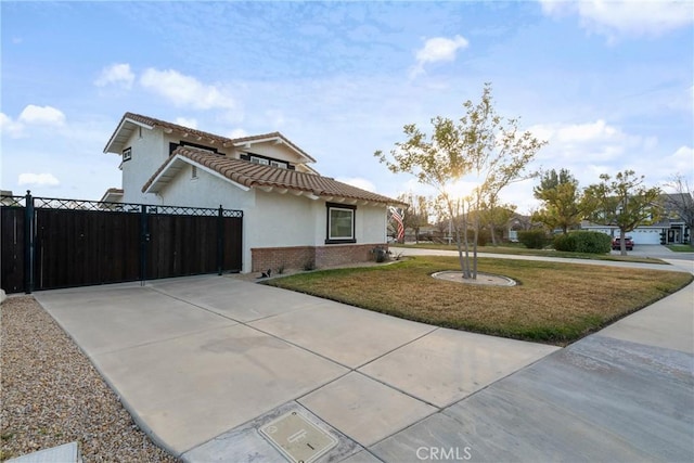 14201 Ross Ct, Rancho Cucamonga, CA 91739 - view of front of property featuring stucco siding, brick siding, driveway, and a tile roof