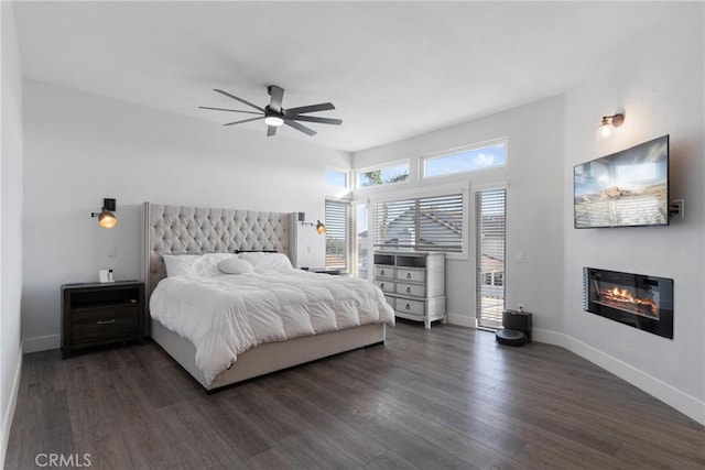 14201 Ross Ct, Rancho Cucamonga, CA 91739 - bedroom with a glass covered fireplace, dark wood-type flooring, and ceiling fan