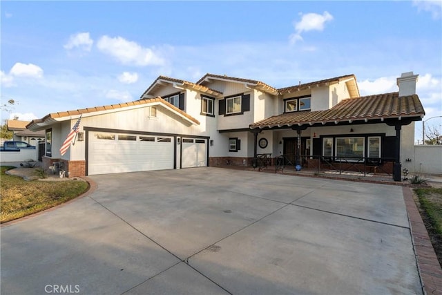 14201 Ross Ct, Rancho Cucamonga, CA 91739 - mediterranean / spanish-style house featuring concrete driveway, a chimney, a tiled roof, an attached garage, and stucco siding