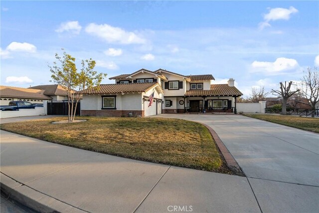 14201 Ross Ct, Rancho Cucamonga, CA 91739 - view of front facade with driveway, stucco siding, a chimney, and a tiled roof