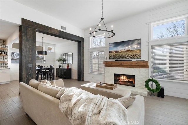 14201 Ross Ct, Rancho Cucamonga, CA 91739 - living room featuring a chandelier, wood finished floors, and healthy amount of natural light