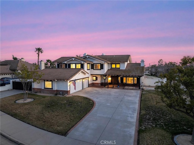 14201 Ross Ct, Rancho Cucamonga, CA 91739 - view of front facade featuring a garage, a chimney, stucco siding, a tile roof, and driveway