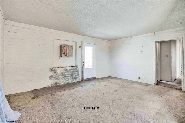 spare room featuring a textured ceiling