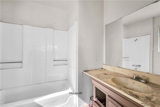 bathroom with bathing tub / shower combination and vanity