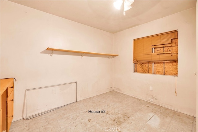 unfurnished room featuring tile patterned floors