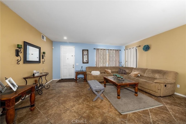 living room featuring visible vents and baseboards