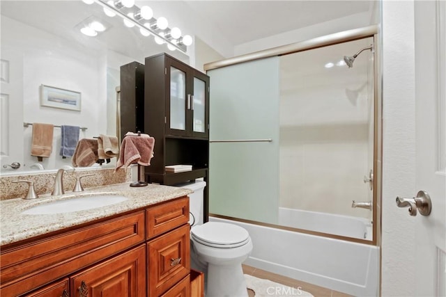 full bathroom with enclosed tub / shower combo, toilet, and vanity