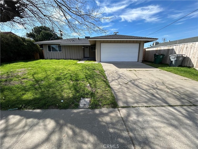 view of front facade featuring a garage, concrete driveway, fence, a front lawn, and board and batten siding