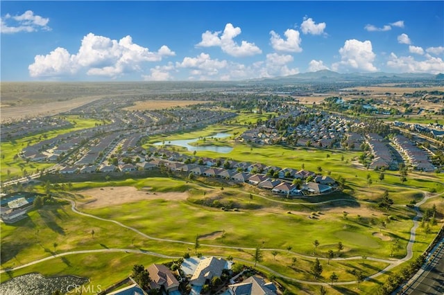 aerial view with a residential view, view of golf course, and a water view